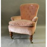 A Victorian button back armchair. 71 cm wide.