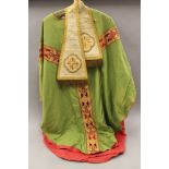 A green silk and gold embroidered cape and neck cloth