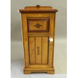 A Victorian Arts and Crafts painted oak bedside cabinet. 39 cm wide.