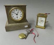 A Victorian slate mantel clock and a carriage clock. The former 19 cm high.