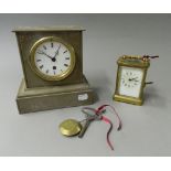 A Victorian slate mantel clock and a carriage clock. The former 19 cm high.