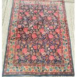 A Persian wool rug with floral ground. 187 x 135 cm.