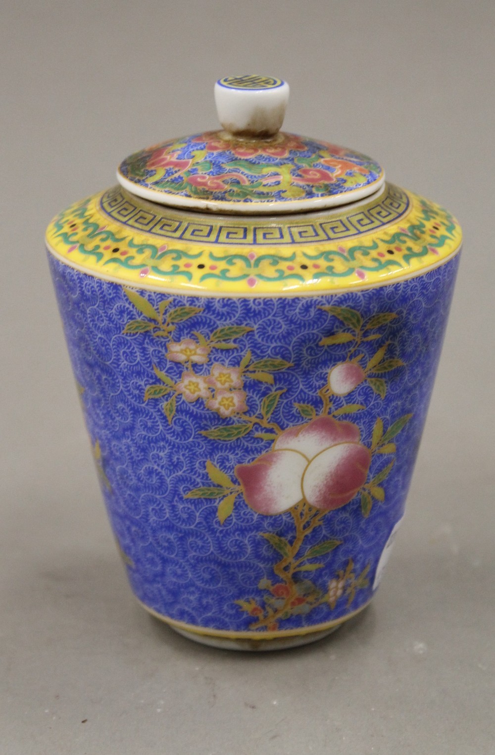 A Chinese porcelain lidded tea jar. 11.5 cm high.