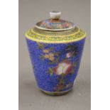 A Chinese porcelain lidded tea jar. 11.5 cm high.