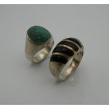 Two gentleman's silver rings (35 grammes)