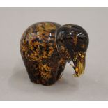 A glass paperweight formed as an elephant. 8 cm high.