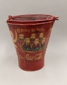 A set of 'Coca-Cola' buckets. The largest 36 cm high.