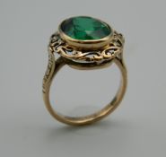An Edwardian 9 ct gold green stone basket design ring (tested 9 ct). Ring Size M.