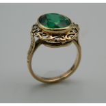 An Edwardian 9 ct gold green stone basket design ring (tested 9 ct). Ring Size M.