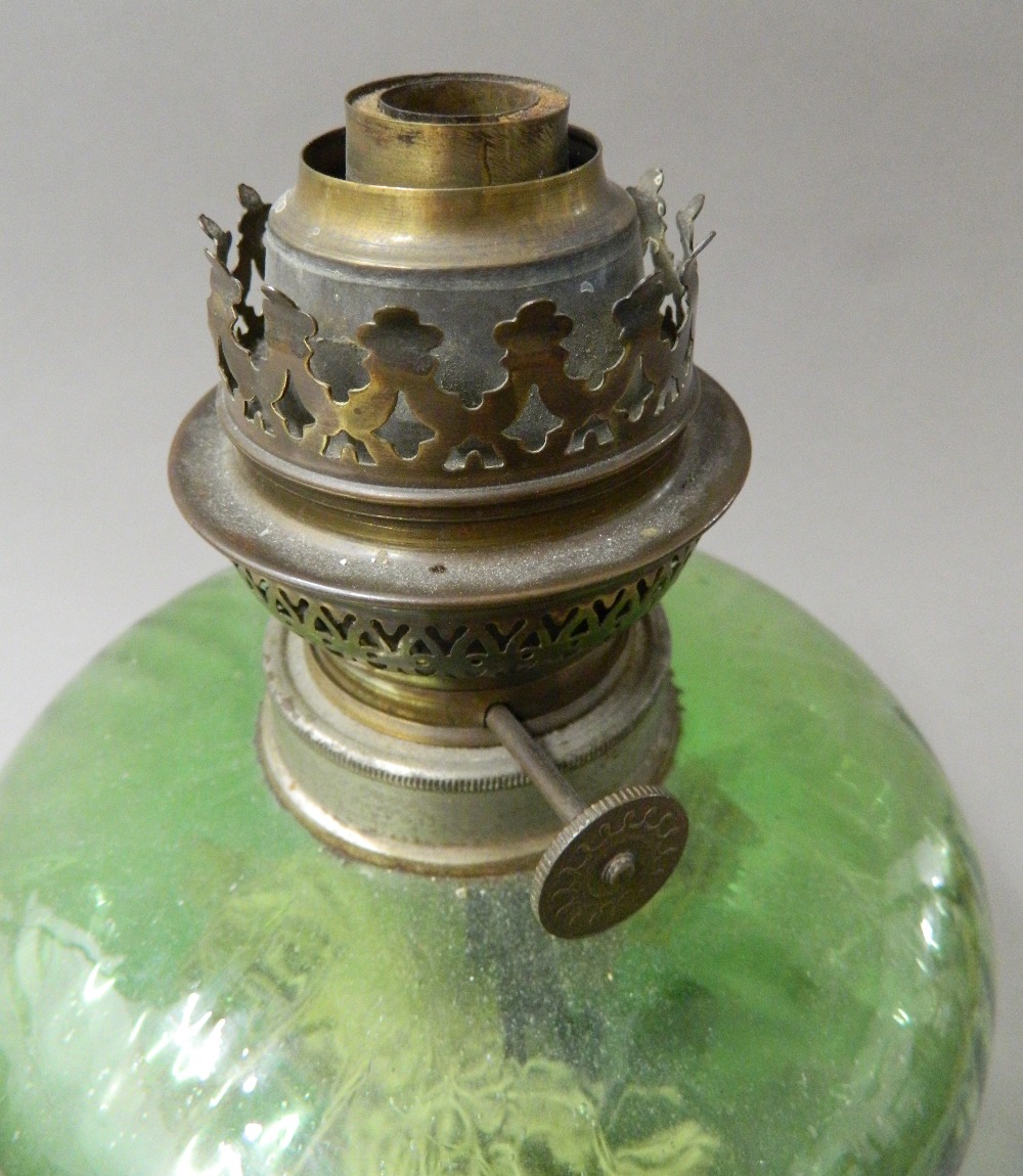 A Victorian oil lamp with green glass reservoir. 52 cm high. - Image 5 of 5