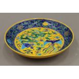 A Chinese yellow and blue porcelain plate. 22 cm diameter.