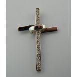A 9 ct white gold and diamond cross. 3 cm high (2.