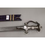 An 18th/19th century Tulwar, 95 cm long, with later scabbard.