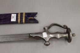 An 18th/19th century Tulwar, 95 cm long, with later scabbard.