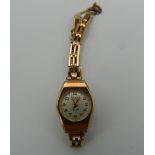 A 9 ct gold cased ladies Tegra wristwatch (13.1 grammes total weight).