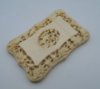 A 19th century Canton carved ivory card case. 11.5 cm high.