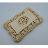 A 19th century Canton carved ivory card case. 11.5 cm high.