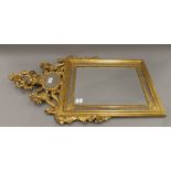 A gilt framed wall glass. 87 cm high.