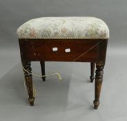 A Victorian upholstered piano stool. 46 cm wide.