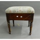 A Victorian upholstered piano stool. 46 cm wide.