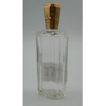 A Continental unmarked gold topped scent bottle. 9 cm high.
