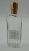 A Continental unmarked gold topped scent bottle. 9 cm high.