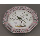 A 19th century Continental hand painted octagonal shaped porcelain charger (possibly formerly a