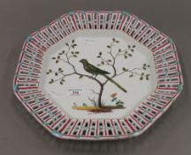 A 19th century Continental hand painted octagonal shaped porcelain charger (possibly formerly a