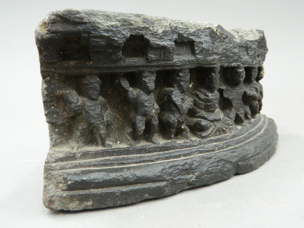 An antique Eastern stone fragment, of curved form, carved with figures wearing offerings to Buddha. - Image 4 of 6