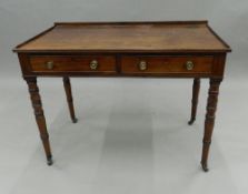 A 19th century mahogany two drawer side table. 91 cm wide.