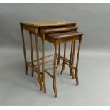 A nest of three early 20th century mahogany tables. 53.5 cm wide.