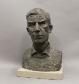 A bronze effect fibre glass male bust on stone display plinth,