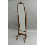 An early/mid-20th century walnut framed cheval mirror. 160 cm high.