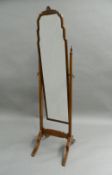 An early/mid-20th century walnut framed cheval mirror. 160 cm high.