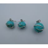 A pair of silver and turquoise earrings with matching pendant. The pendant 2 cm high.