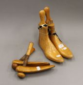 Two pairs of treen shoe lasts. The largest 24.5 cm high.