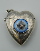 A silver heart shaped vesta with Masonic emblem. 4 cm high.