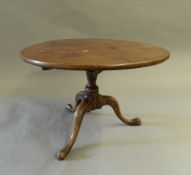 A 19th century mahogany tripod table, reduced in height. 78 cm diameter.