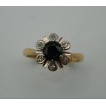 An 18 ct gold sapphire and diamond ring. Ring Size L/M (3.