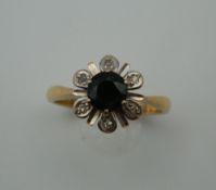 An 18 ct gold sapphire and diamond ring. Ring Size L/M (3.