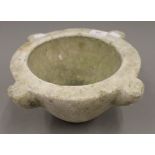 A marble mortar. 31 cm wide.