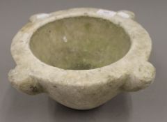 A marble mortar. 31 cm wide.