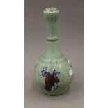 A Chinese celadon ground garlic neck vase. 27 cm high.