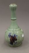 A Chinese celadon ground garlic neck vase. 27 cm high.