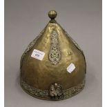 An Antique Ottoman/Turkish brass helmet. 22 cm high.