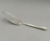 A George III silver fish slice. 28.5 cm long (4.