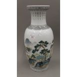 A Chinese Republic vase decorated with mountainous scenes. 47 cm high.