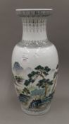 A Chinese Republic vase decorated with mountainous scenes. 47 cm high.