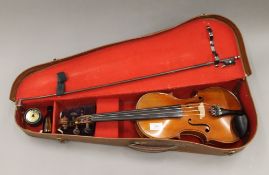 A 19th century violin with bow and case,