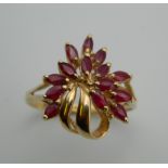A 9 ct gold ruby bouquet design ring. Ring Size R.